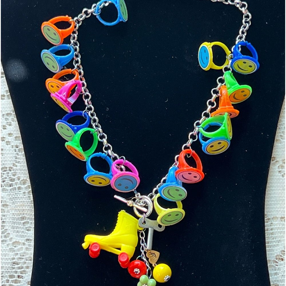 👑Adorned Crown artisan assemblage child’s roller skate happy face necklace
